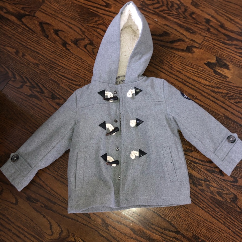 Grey peacoat with toggles and fur hood